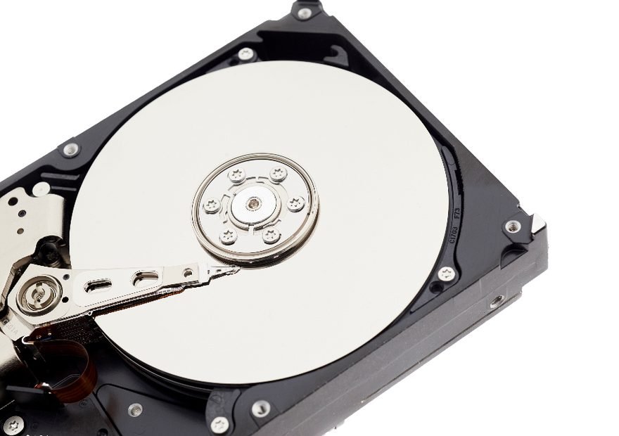 Opened hard disk drive showing platters and read head during data recovery